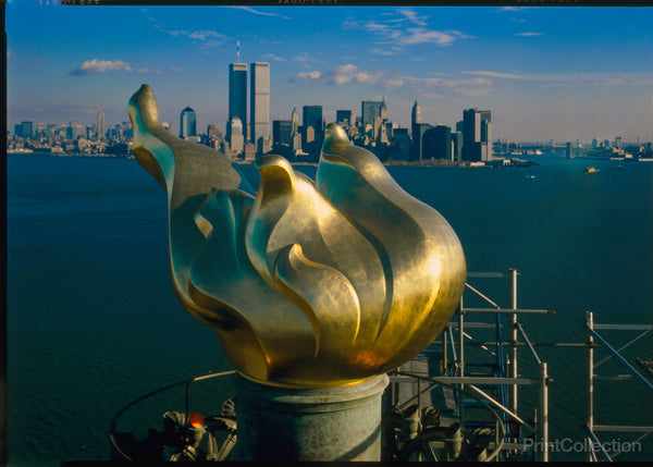 New Torch and Flame with Manhattan skyline in background, December 17, 1985. Statue of Liberty New Torch and Flame with Manhattan skyline in background, December 17, 1985. Statue of Liberty