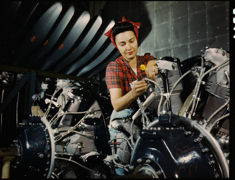 Woman Working on an Airplane Motor Woman Working on an Airplane Motor