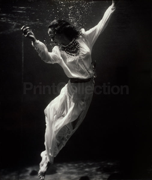 Fashion Model Underwater in Dolphin Tank