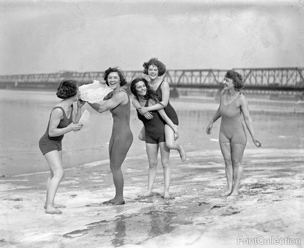 Five Women in Swimsuits on Icy Beach